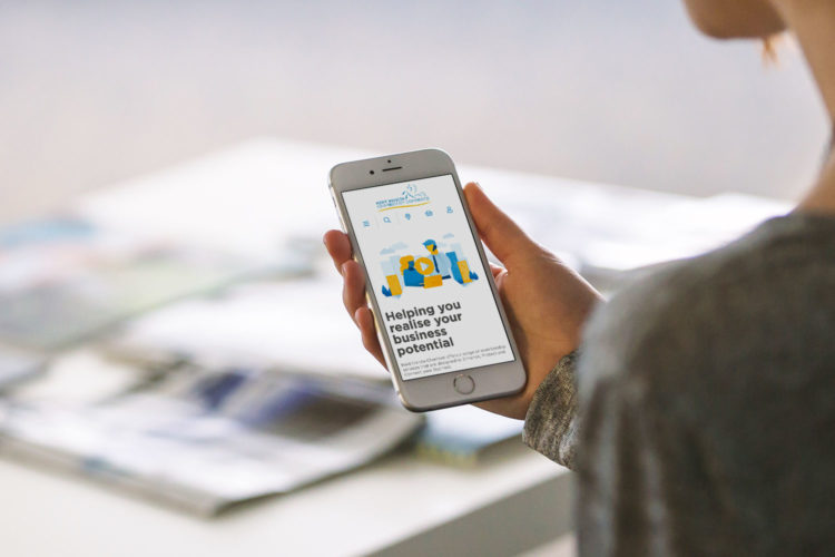 Custom WordPress and WooCommerce eCommerce website for Kent Invicta Chamber of Commerce shown on an iPhone by Supersonic Playground